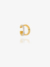 gold and silver ear cuff on white background