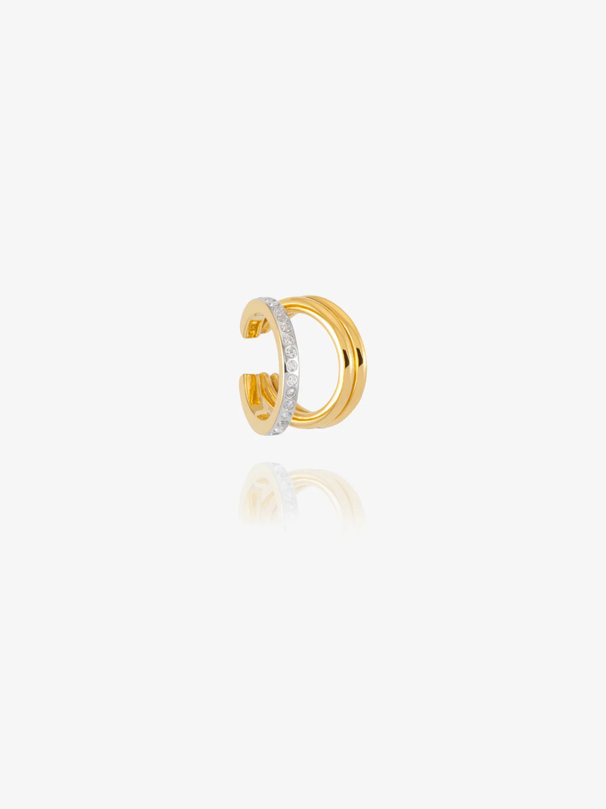 gold and silver ear cuff on white background