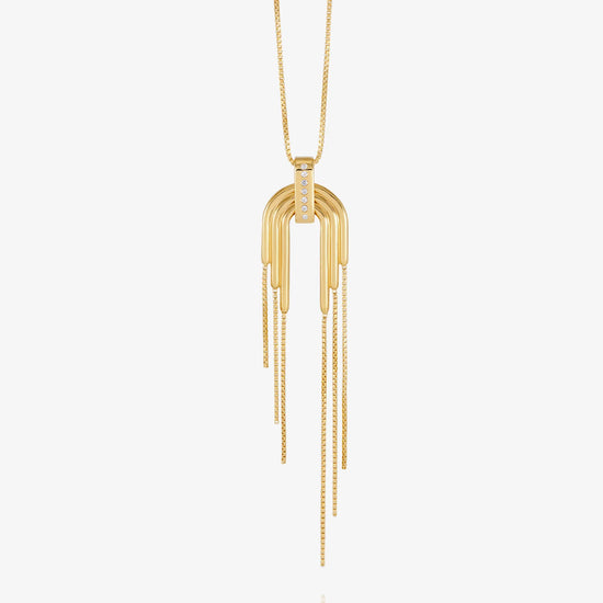 A gold pendant necklace featuring a multi-bar arch design with hanging chain tails, displayed against a clean white background.