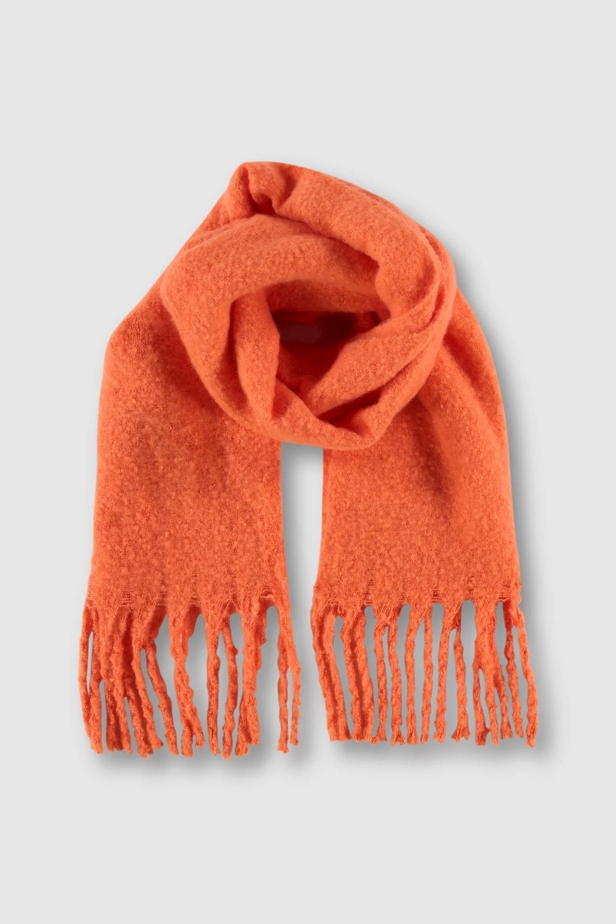 Orange coloured furry oblong scarf with tassels