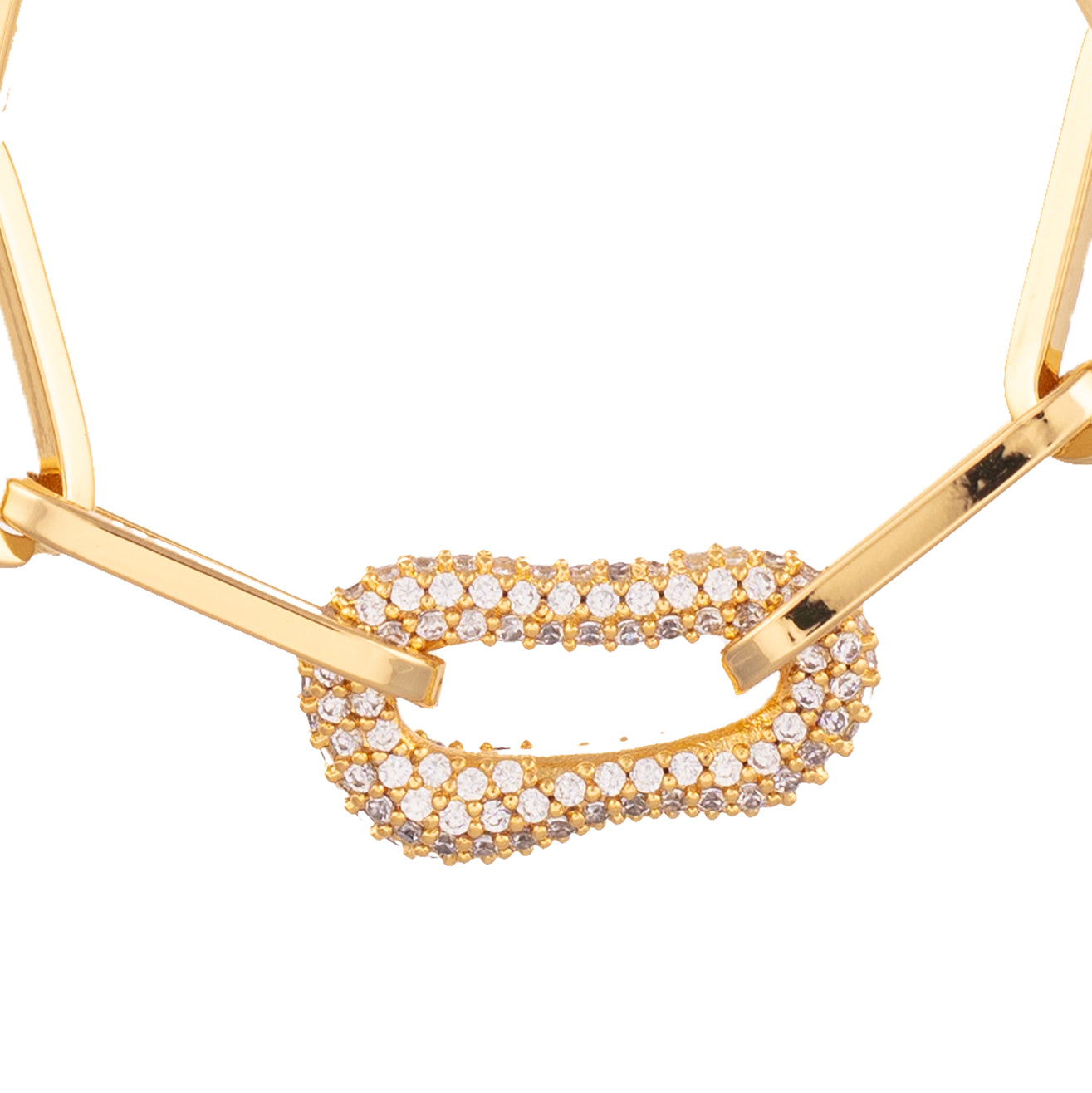 gold chain bracelet with single cubic zirconia link close up