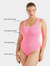 Woman wearing a pink swimsuit with labeled features on a white background