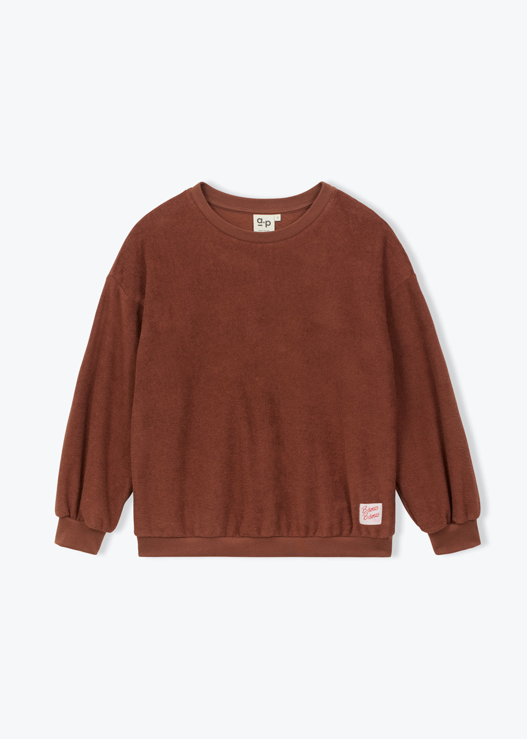 A brown long-sleeve crewneck sweatshirt with a small pink brand tag on the lower right hem, displayed flat against a light gray background.