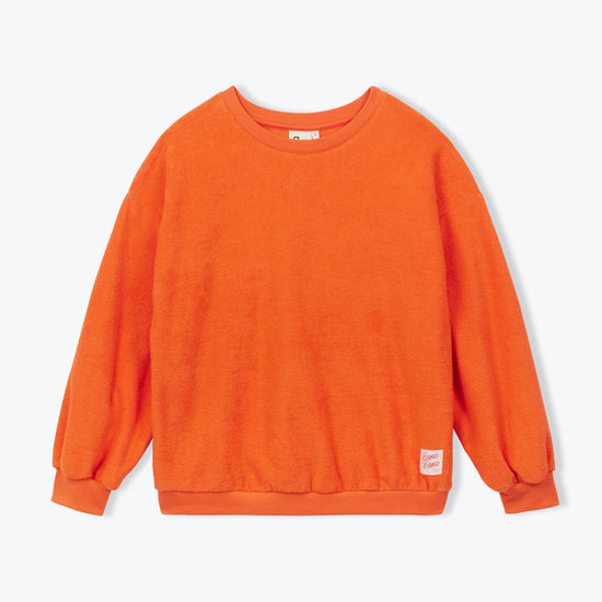 An orange crewneck sweatshirt with long sleeves and ribbed cuffs, shown flat against a light gray background.