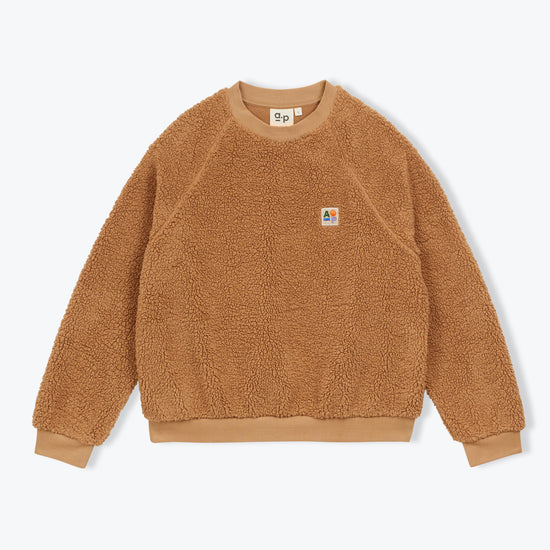 Brown fleece jumper on a white background