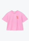 A light pink short-sleeve crop top t-shirt with a small orange graphic on the left chest, displayed flat against a light gray background.