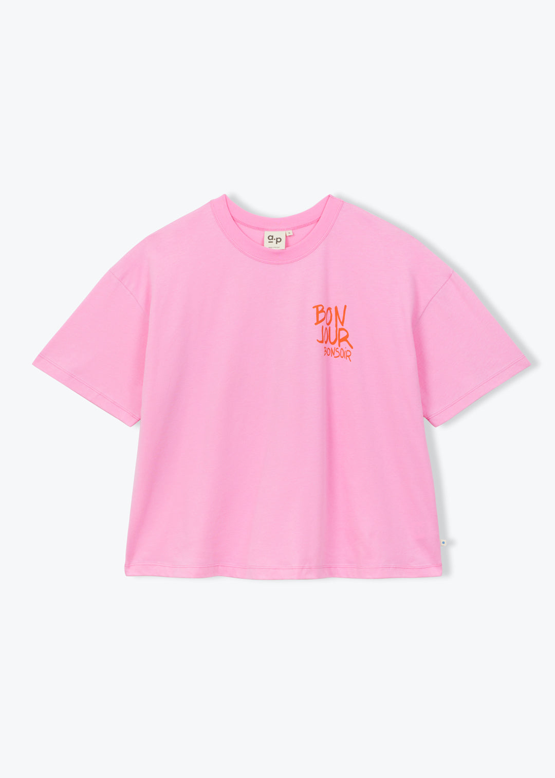 A light pink short-sleeve crop top t-shirt with a small orange graphic on the left chest, displayed flat against a light gray background.
