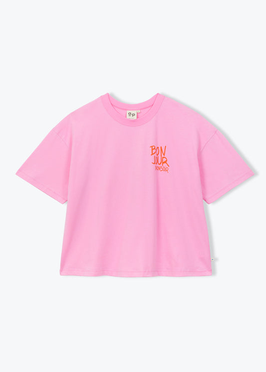 A light pink short-sleeve crop top t-shirt with a small orange graphic on the left chest, displayed flat against a light gray background.
