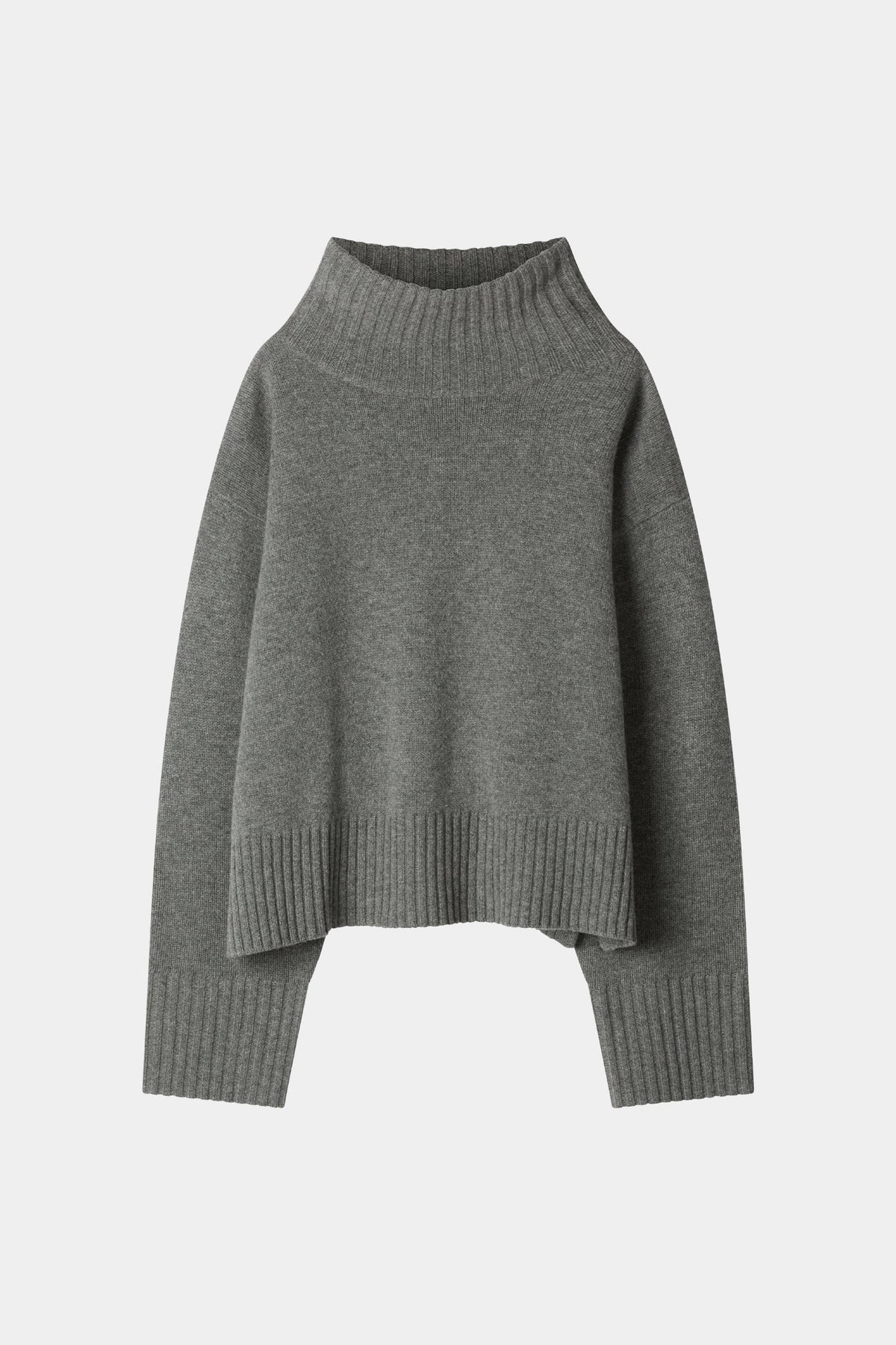 A dark gray knit turtleneck sweater with a relaxed, oversized fit, ribbed collar, cuffs, and hem, displayed against a light gray background.