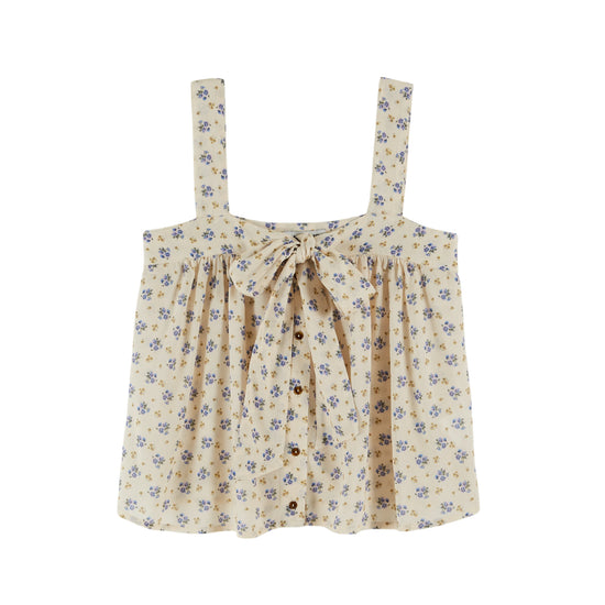 wide strap cream cami with bow on front, button down and small floral blue print throughout