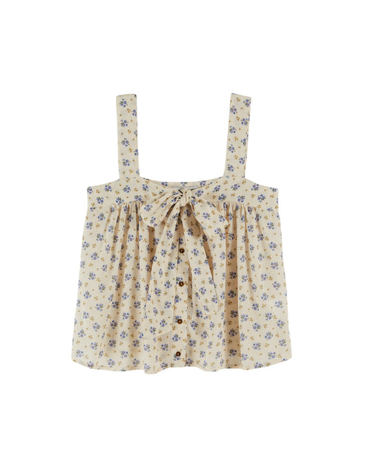 wide strap cream cami with bow on front, button down and small floral blue print throughout