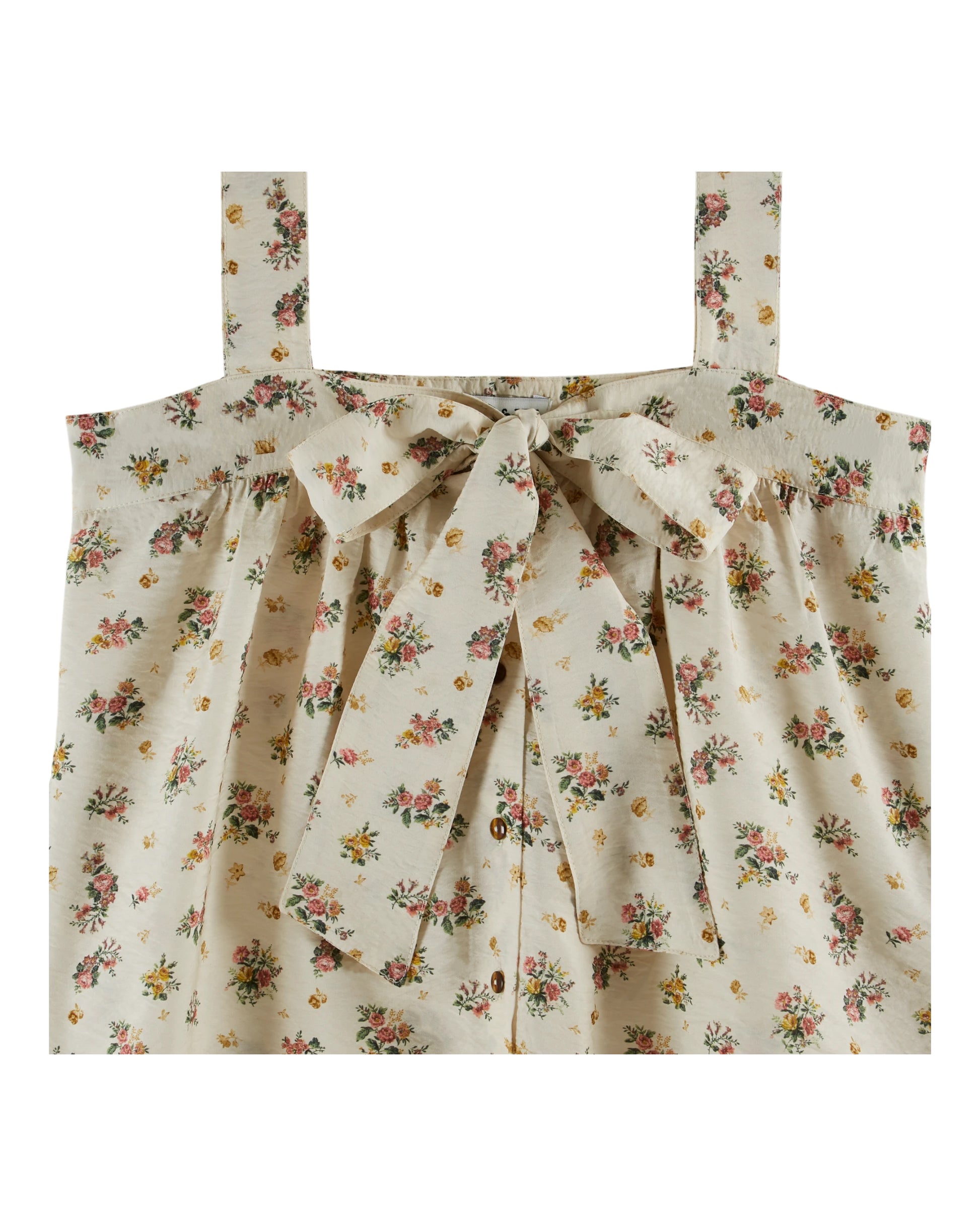 wide strap cream cami with bow on front, button down and small floral print throughout close up