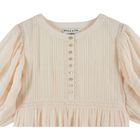 cream round neck short sleeve midi dress with buttoned half placket from emile and ida  close up