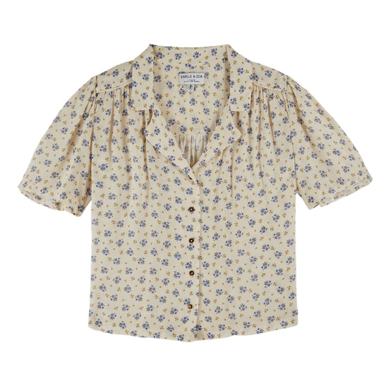 v neck small collar short sleeve cream top with blue floral print throughout from emile and ida