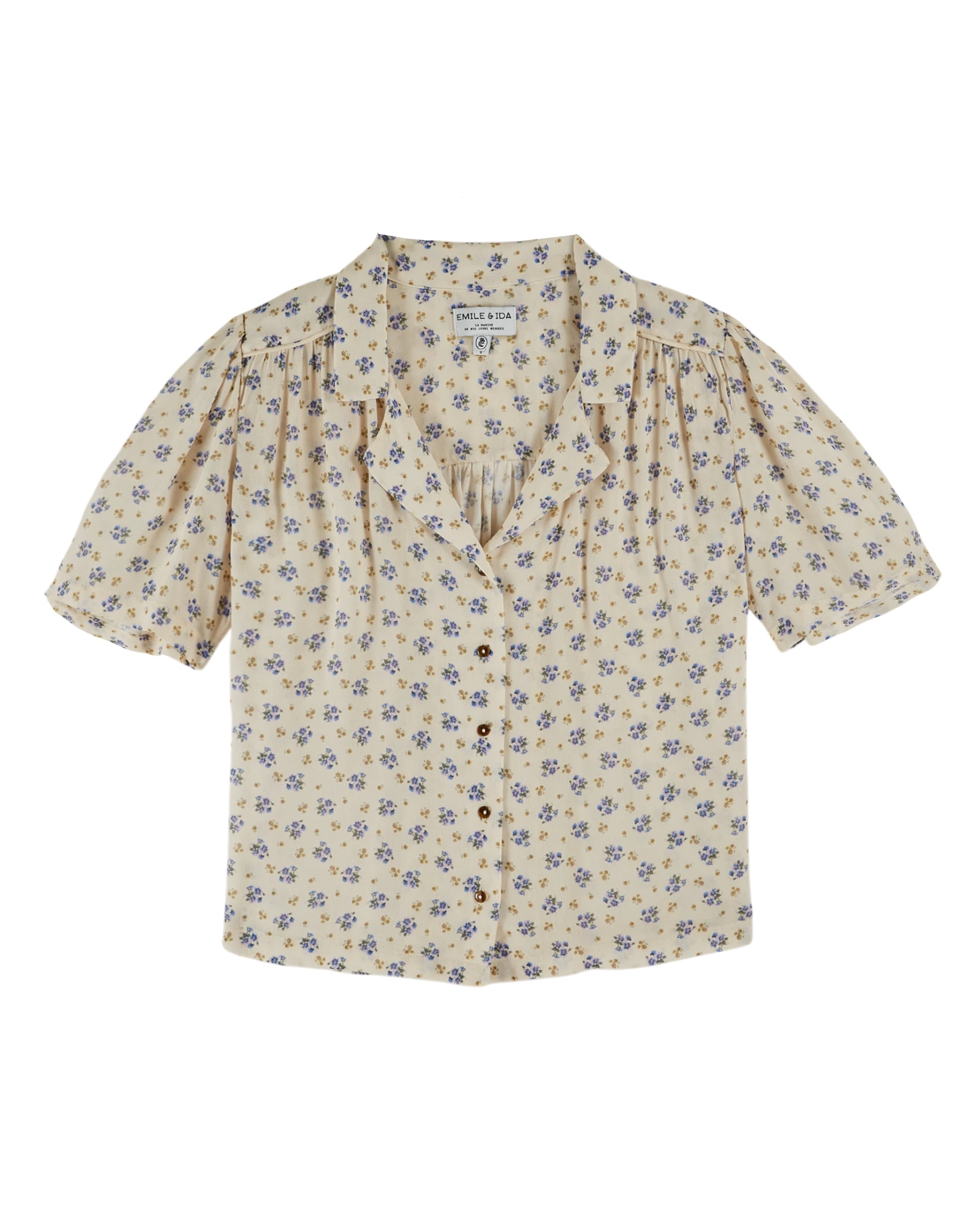 v neck small collar short sleeve cream top with blue floral print throughout from emile and ida