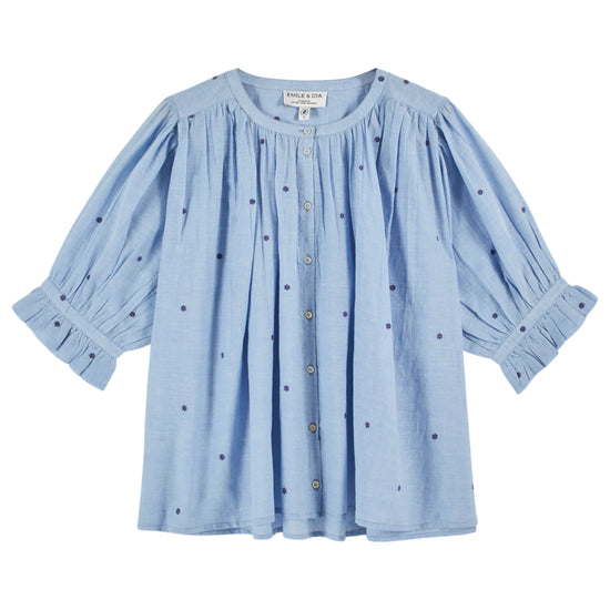 round neck button down blue blouse with short puffy sleeves and small dark blue dots throughout from emile and ida