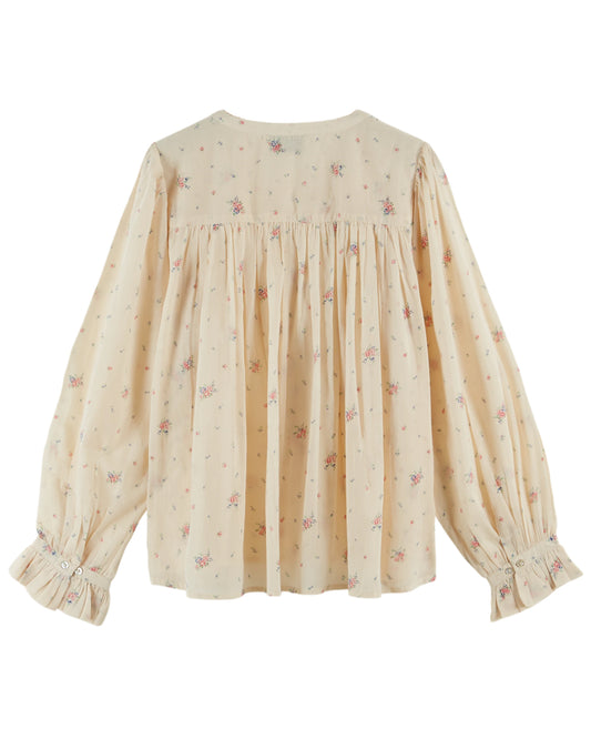 round neck raglan sleeve cream button down blouse with pink flowers all over from emile and ida rear 
