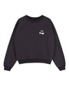 A black crewneck sweatshirt with raglan sleeves, featuring a small white embroidered cherry graphic on the left chest, displayed against a solid white background.