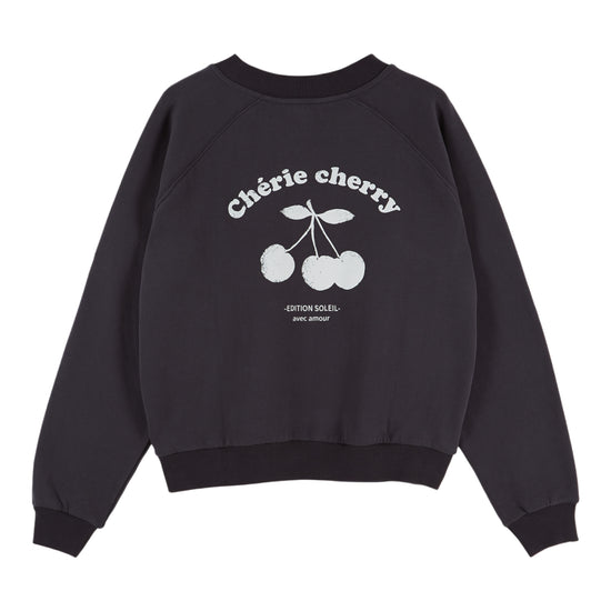 A black crewneck sweatshirt featuring a white graphic print of cherries on the front with the text 'Chèrie cherry' and 'GRENADAS COFFEE'.