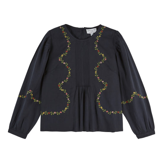 black blouse with flower embroidery on white background
