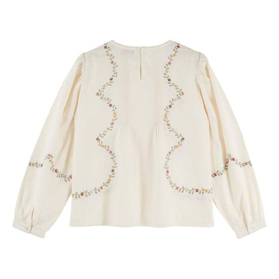 cream blouse with flower embroidery on white background rear view