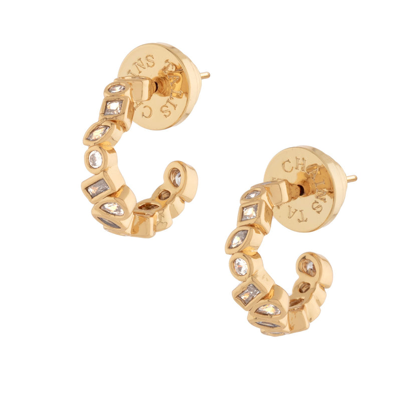 gold plated brass base metal huggie hoops earrings with cz stones close up