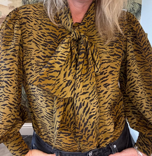 tiger print blouse with pussy bow at the neck, deep cuffs and collar from tabitha webb model shot
