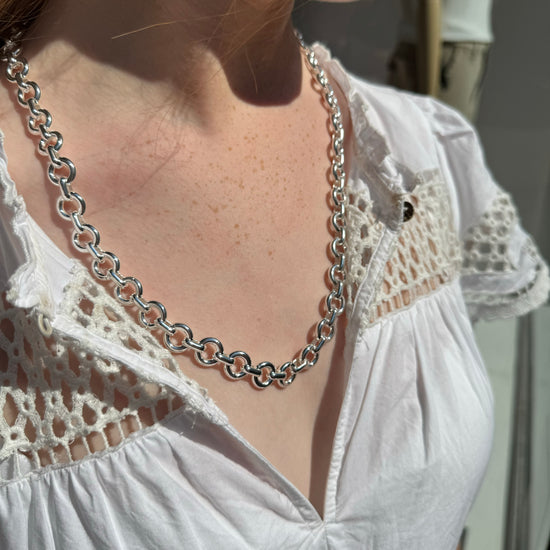 silver donut style chain necklace model shot