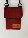 red pinstripe waterproof messenger bag with cross body strap