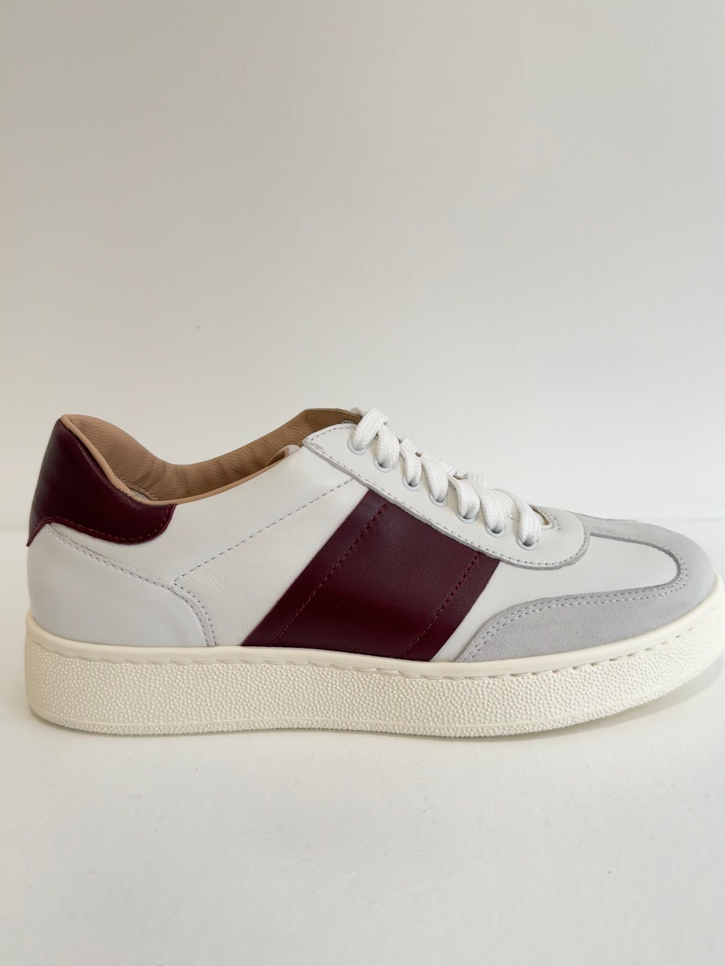 white leather trainer with deep red details