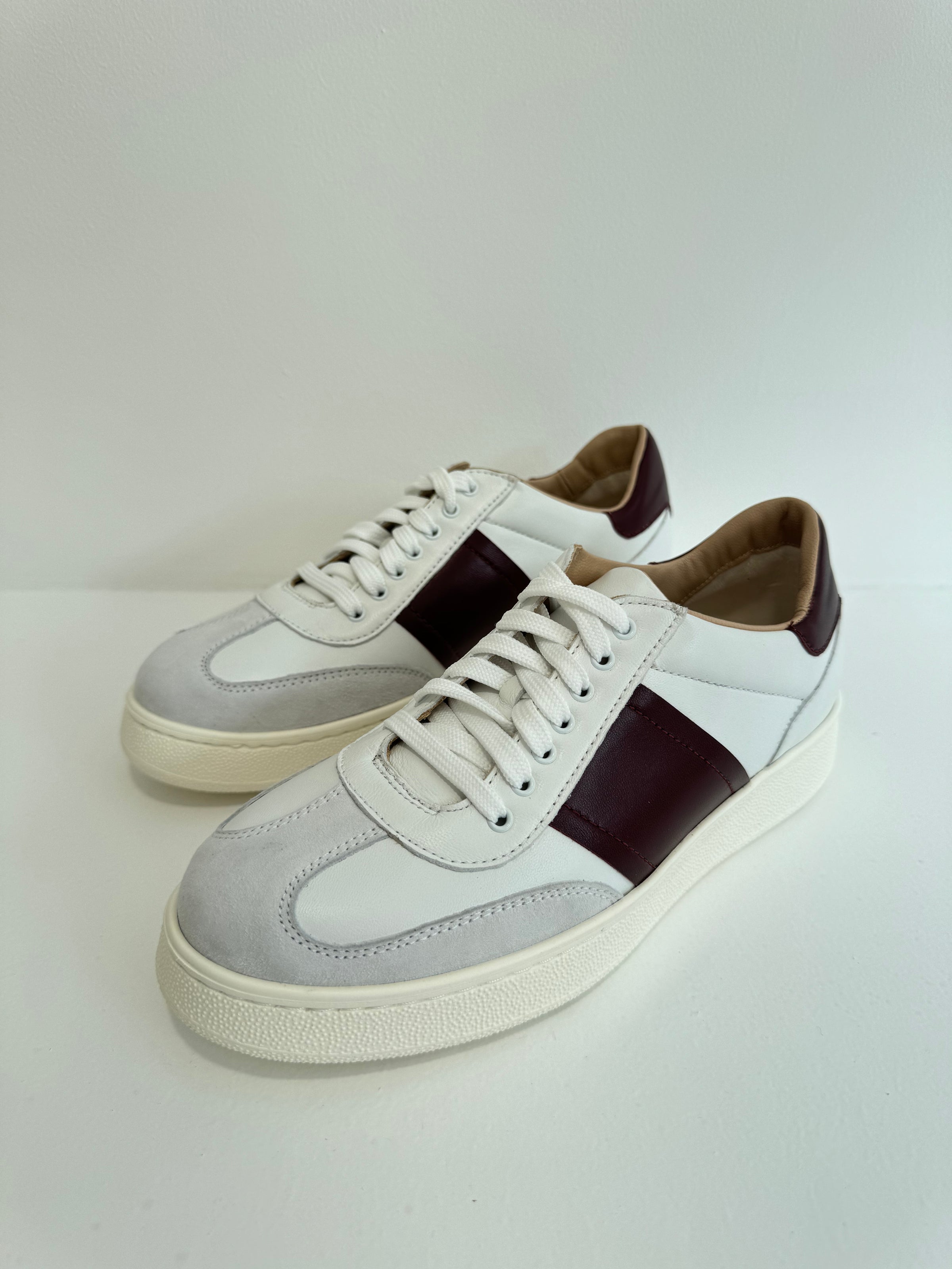 White leather trainers with burgundy side stripe and rear tab