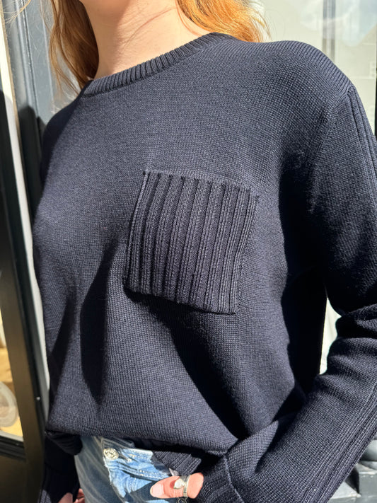 navy merino wool jumper with front patch pocket  close up
