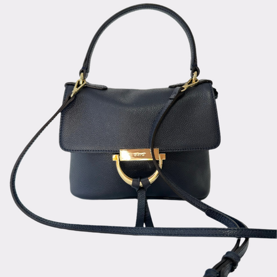 Small navy handbag with gold touches with a longer and short strap.