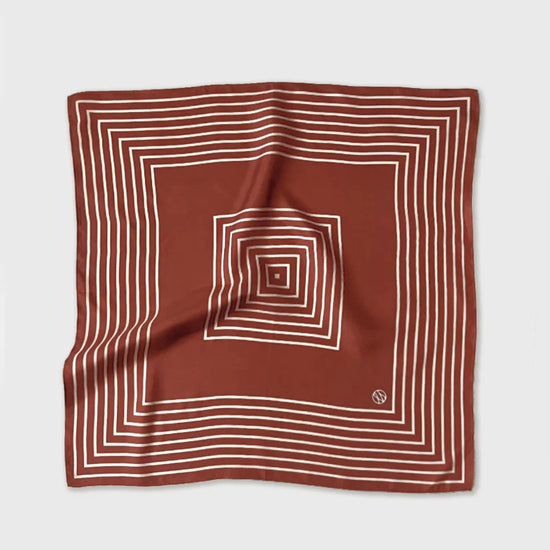 Brown square scarf with white concentric lines on a light gray background