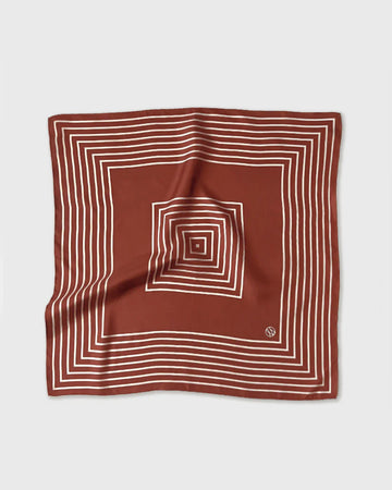Brown square scarf with white concentric lines on a light gray background