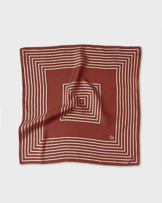 Brown square scarf with white concentric lines on a light gray background