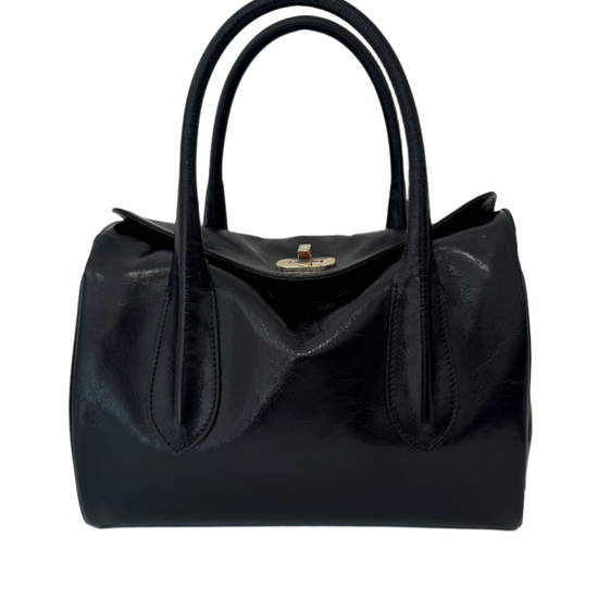 Black shiny leather handbag with shoulder straps and gold buckle detailing.