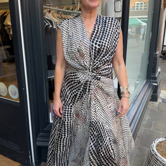 Black and white floaty dress with beautiful silver and gold accessories.