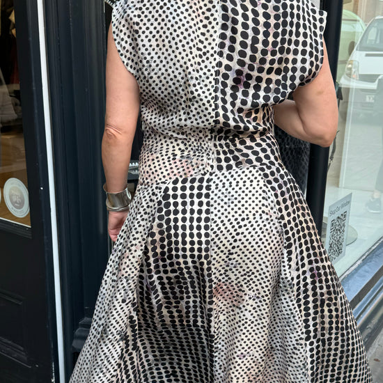 Black and white floaty dress with beautiful silver and gold accessories.