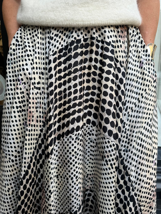 Black and white spotted design skirt.