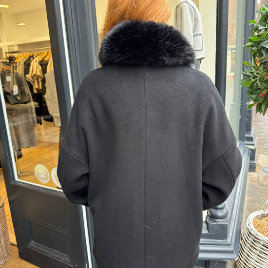 Navy coat with faux fur collar.