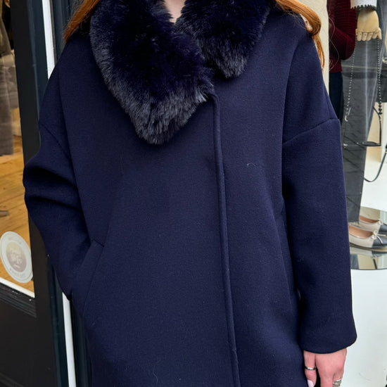 Navy coat with faux fur collar.