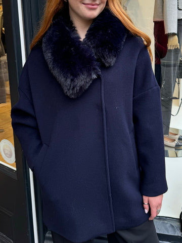 Navy coat with faux fur collar.