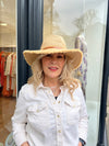 Adjustable sized Raffia hat with a broad rim and leather look detail