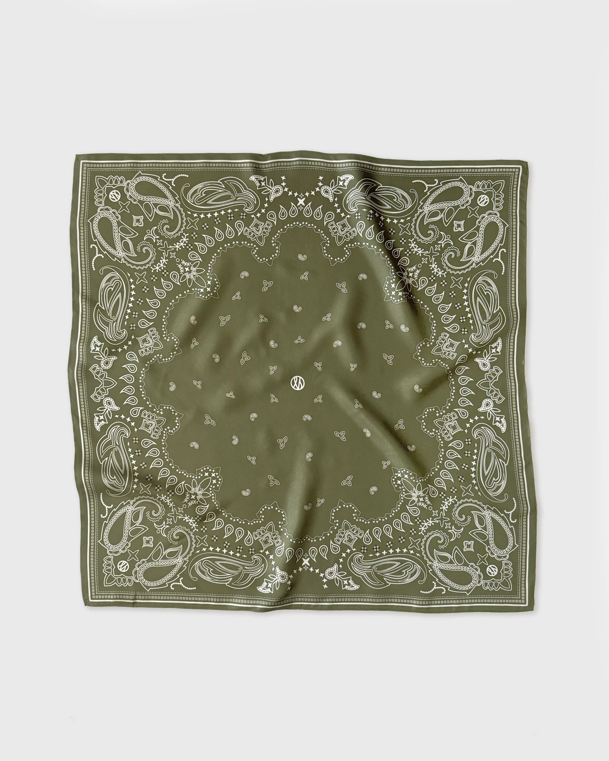 Green bandana with white patterns on a white background