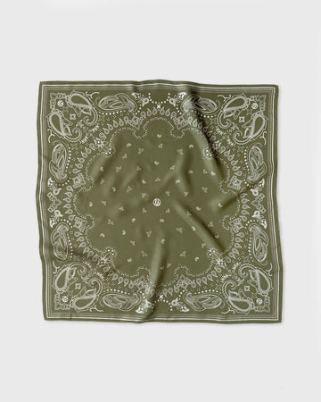 Green bandana with white patterns on a white background