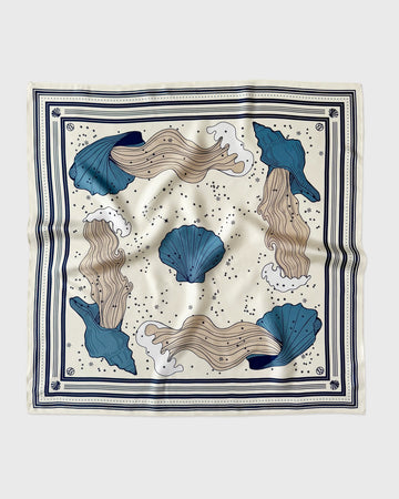 Decorative scarf with blue and beige sea-themed design on a white background