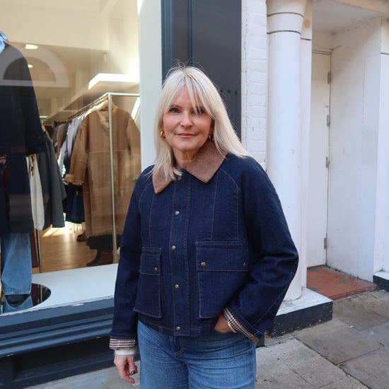 dark blue denim jacket with brown collar 