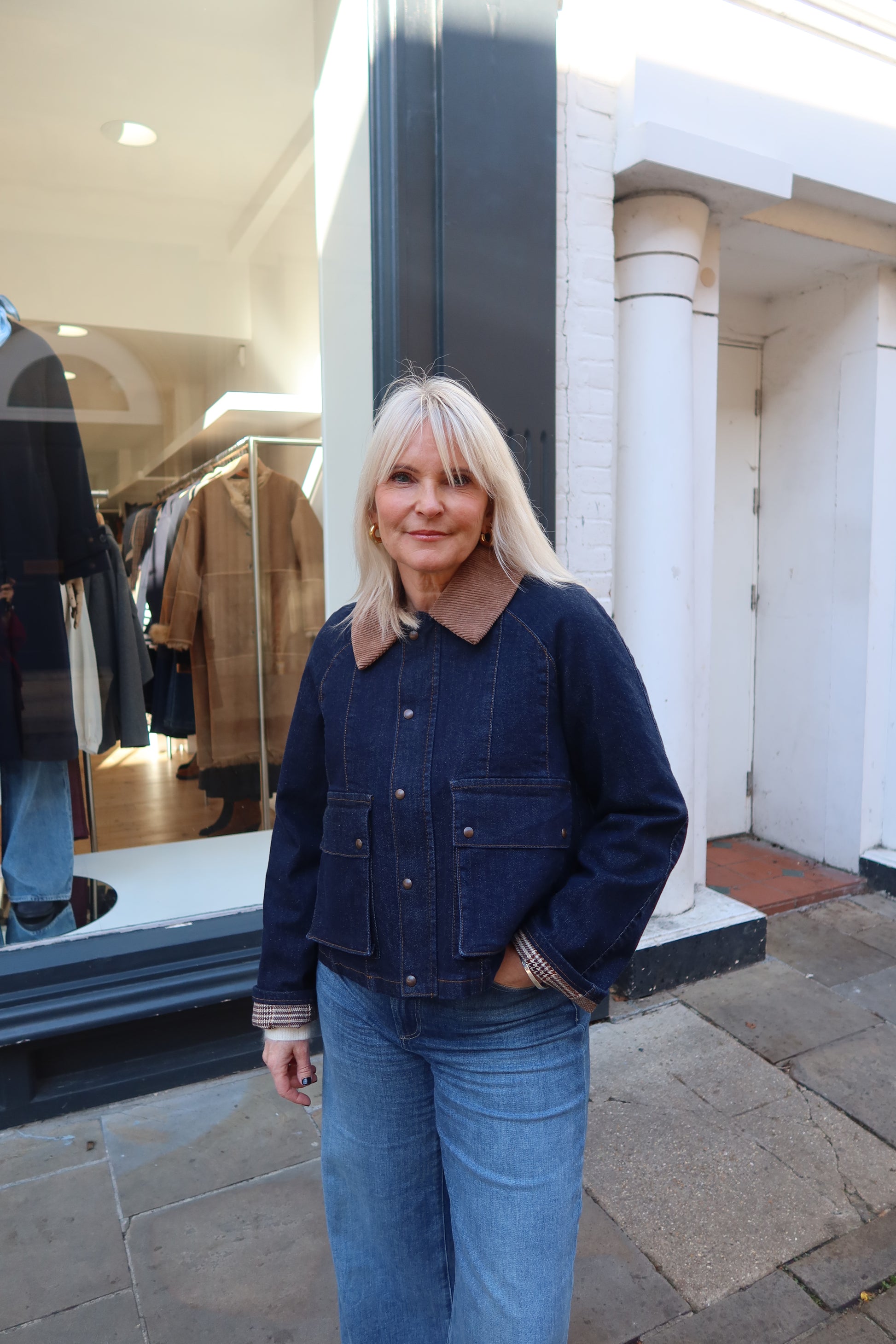 dark blue denim jacket with brown collar 