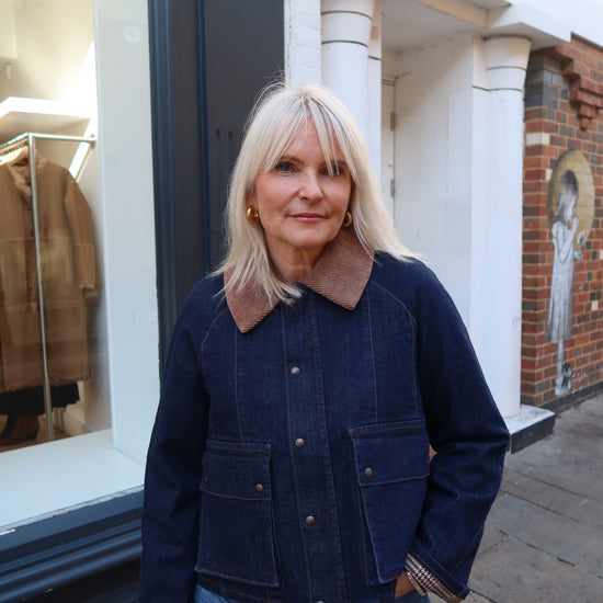 dark blue denim jacket with brown collar 